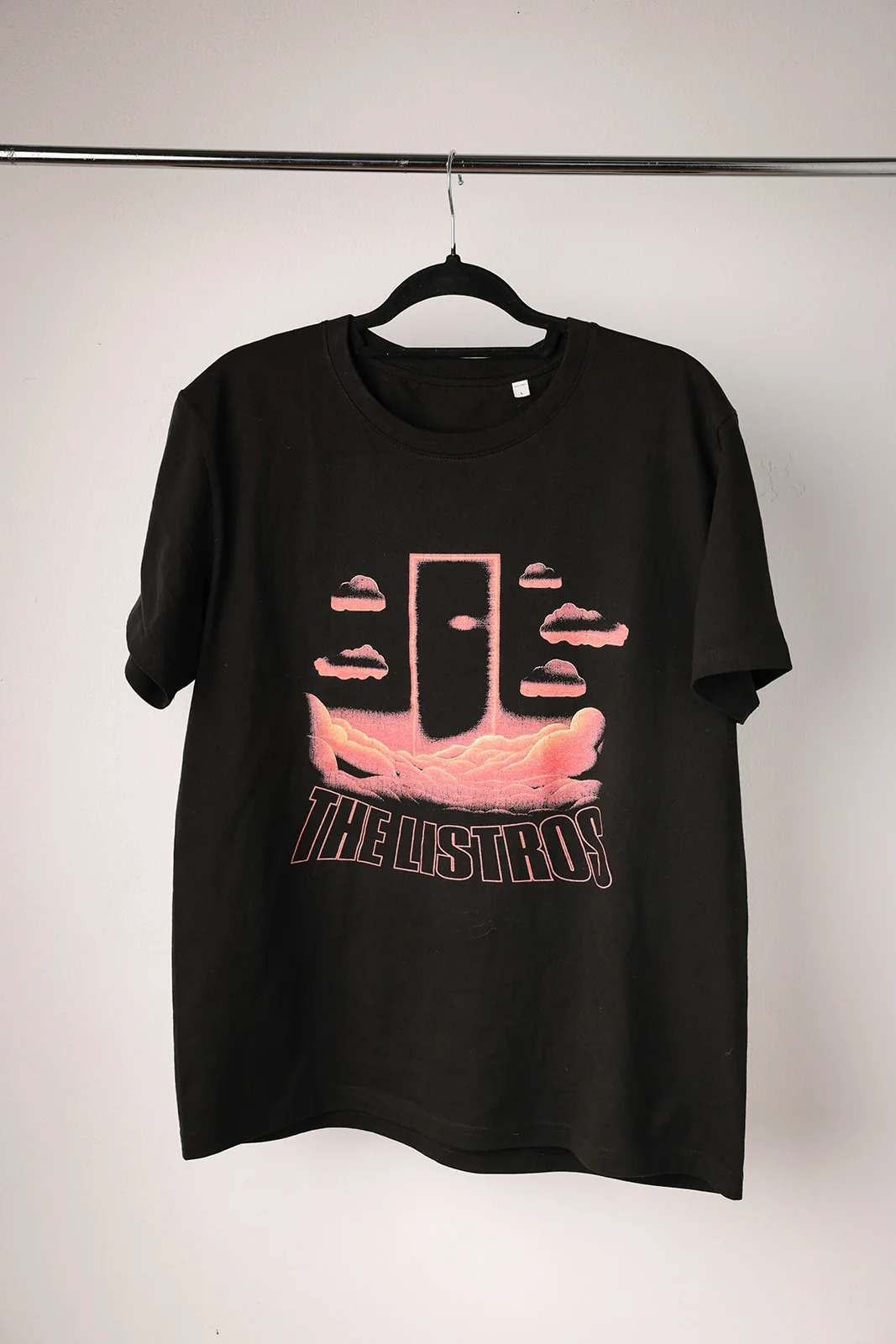 a black t - shirt with an image of a door on it