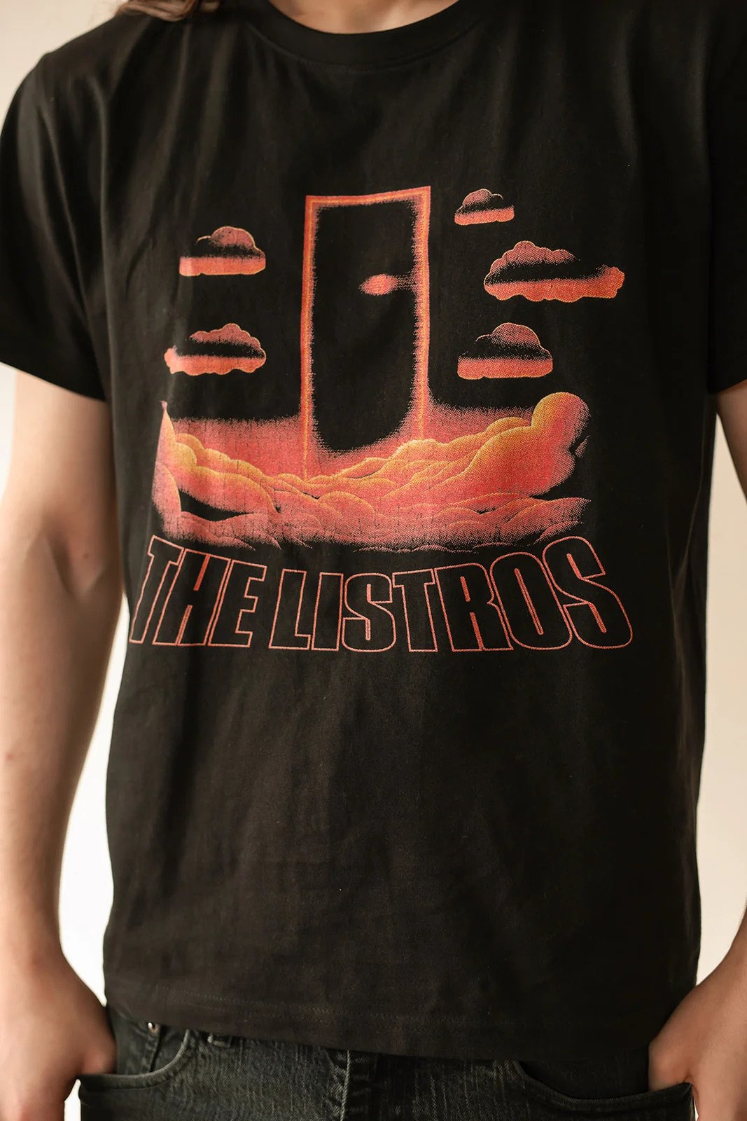 a man wearing a black t - shirt that says the losers