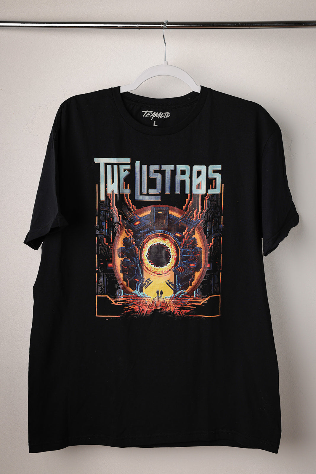 a black t - shirt with an image of the ultras on it
