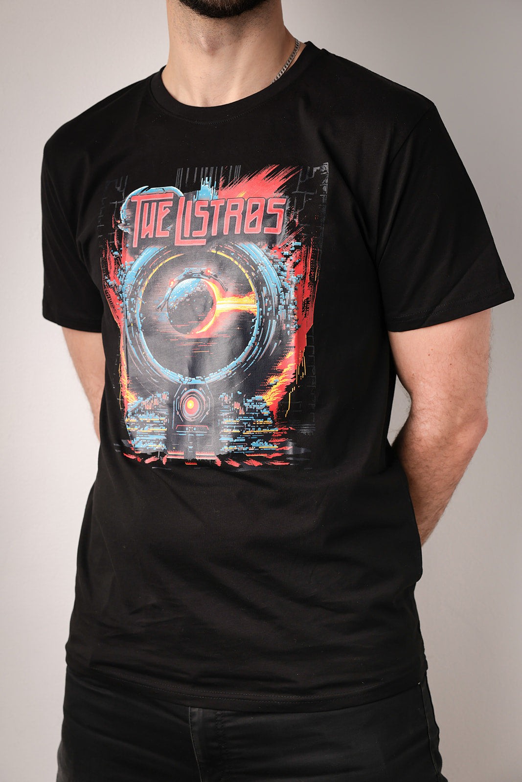 a man wearing a black t - shirt with an image of the stars