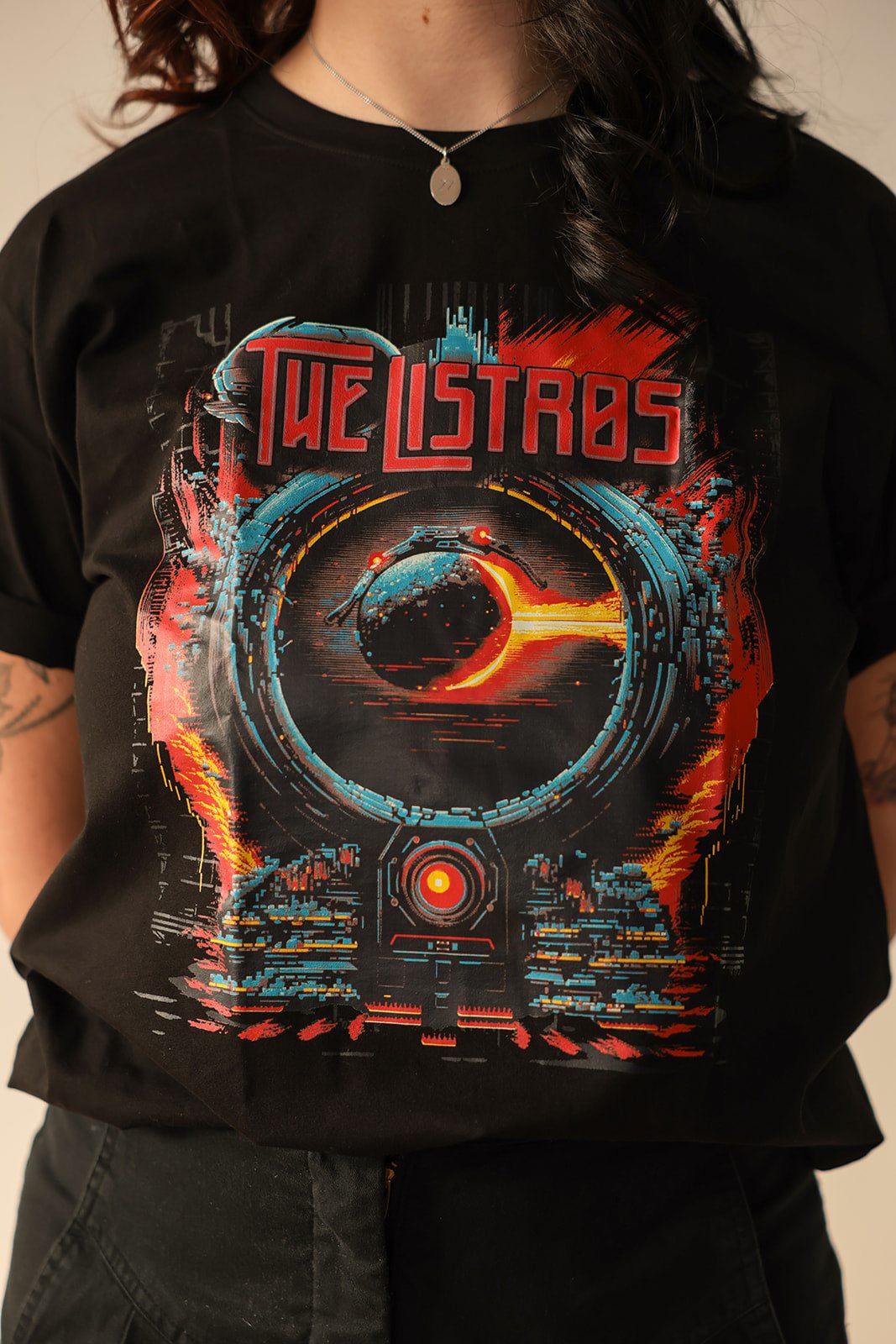 a woman wearing a black t - shirt that says the last bastards