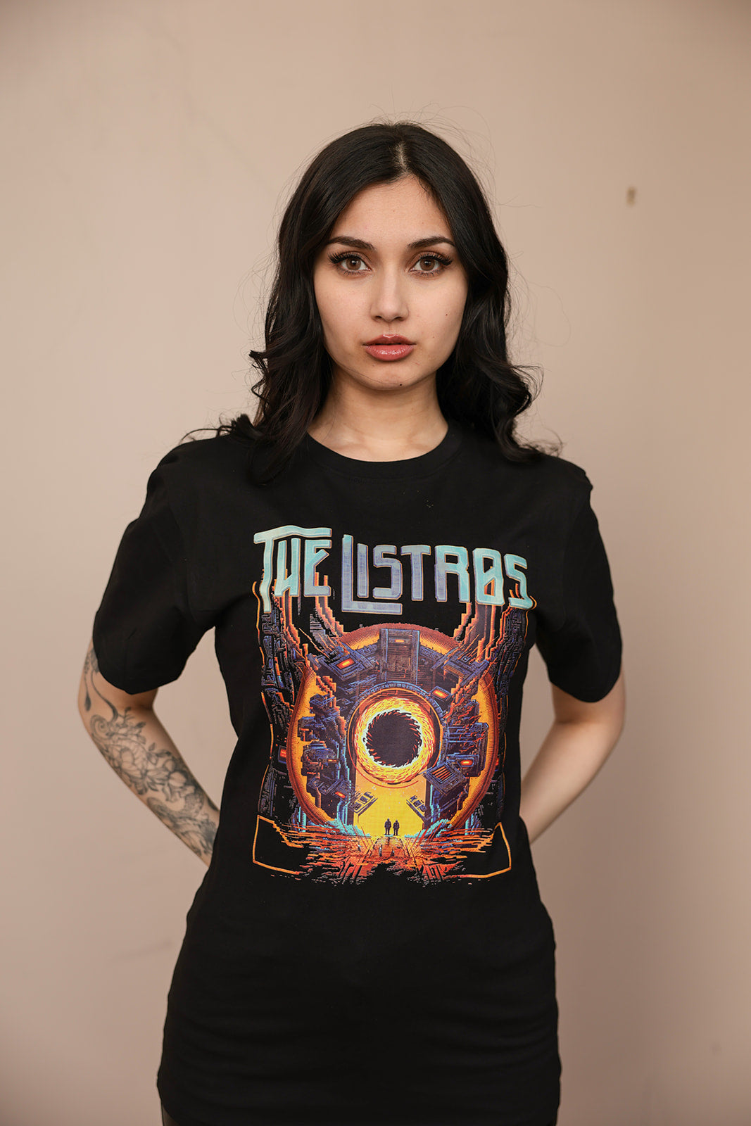a woman wearing a black t - shirt that says the last stars
