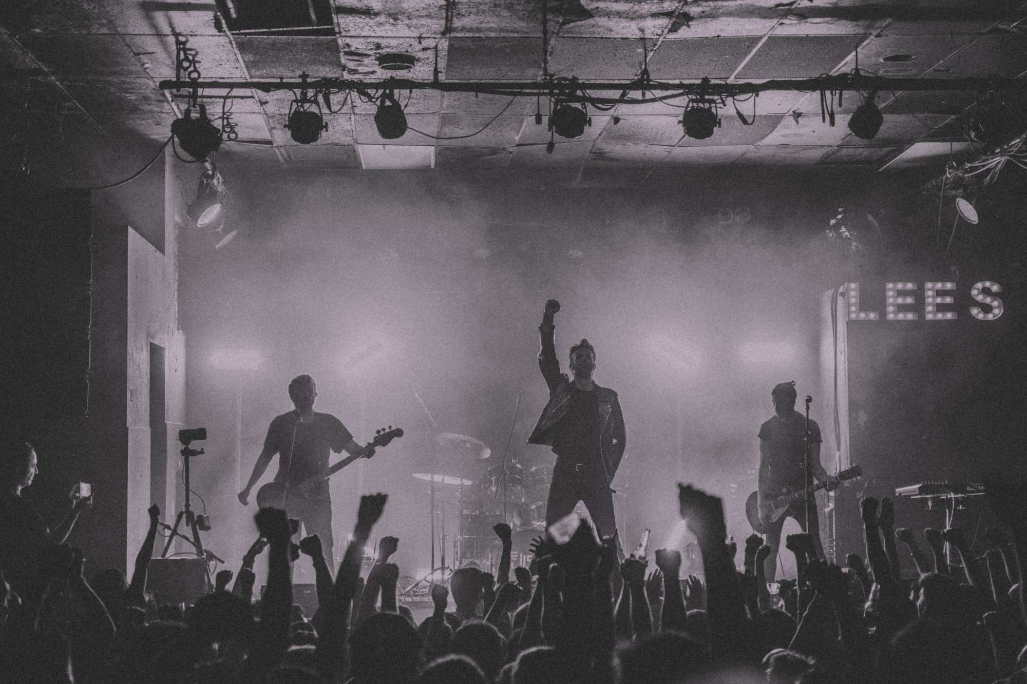 a black and white photo of a crowd at a concert