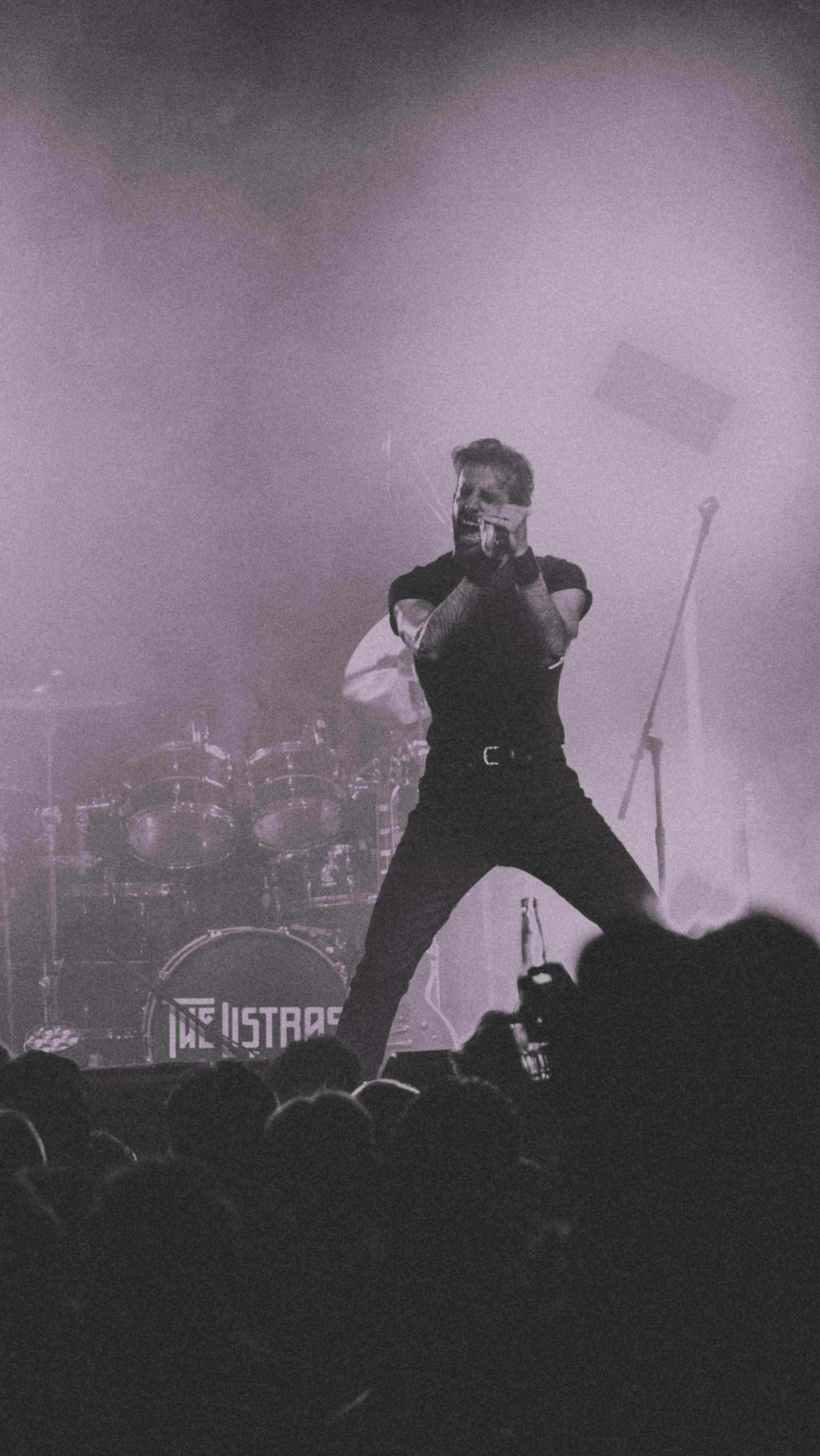 a man standing on stage at a concert