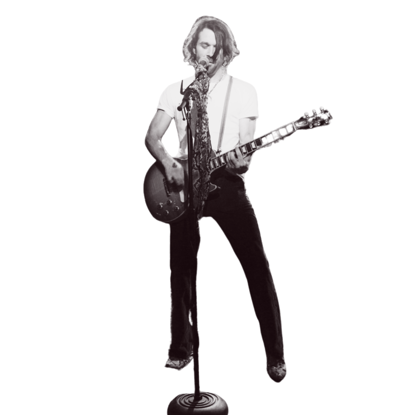 johnny depp playing guitar in front of a microphone