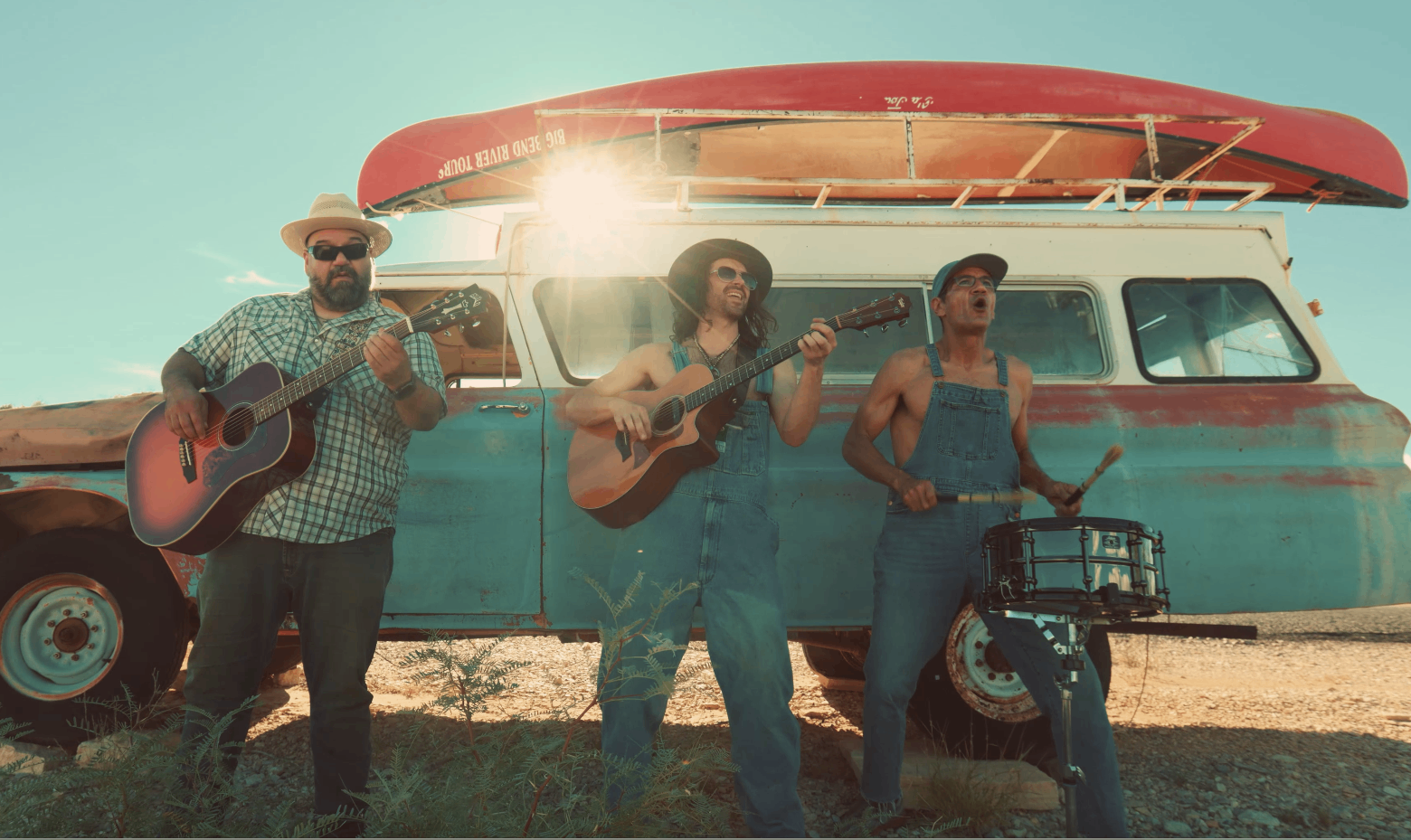 a group of people standing in front of a van