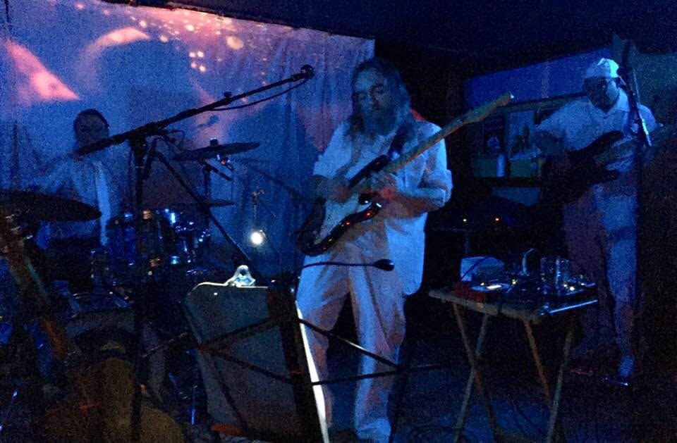 image may contain person, on stage, playing a musical instrument and night