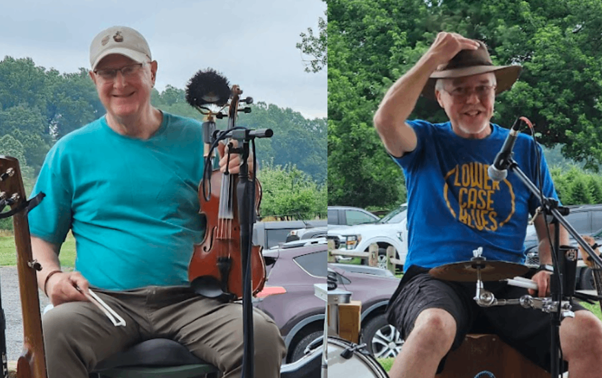 two men in hats are playing instruments in a parking lot