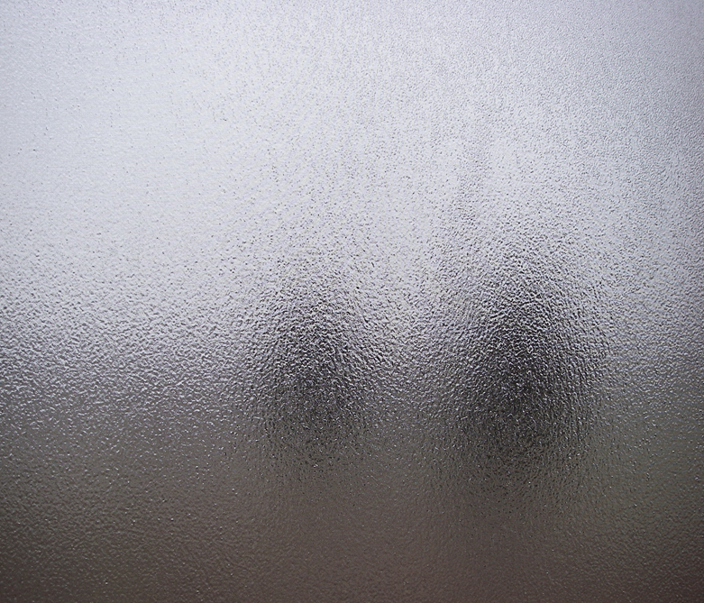 a close up of a window with frosted glass