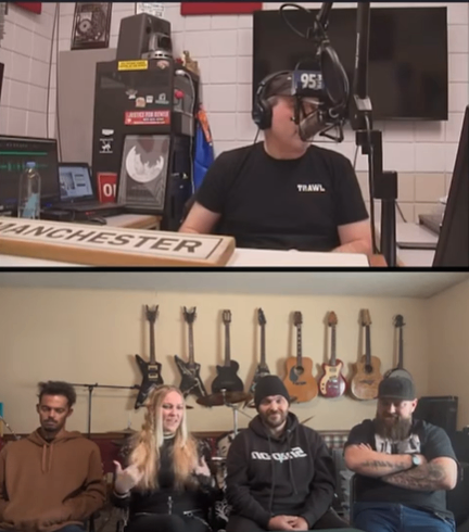 a group of people are sitting in front of a microphone