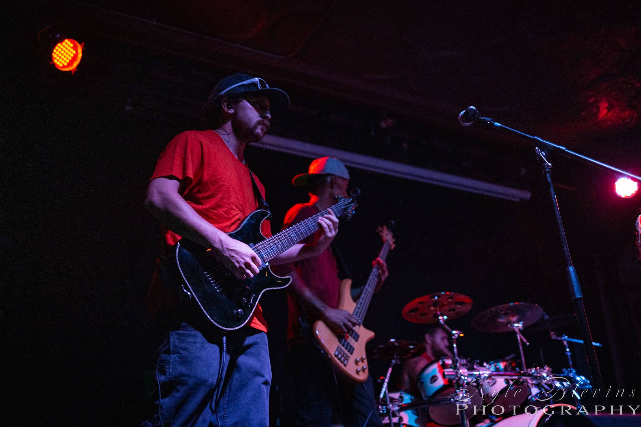 a group of people playing music on stage