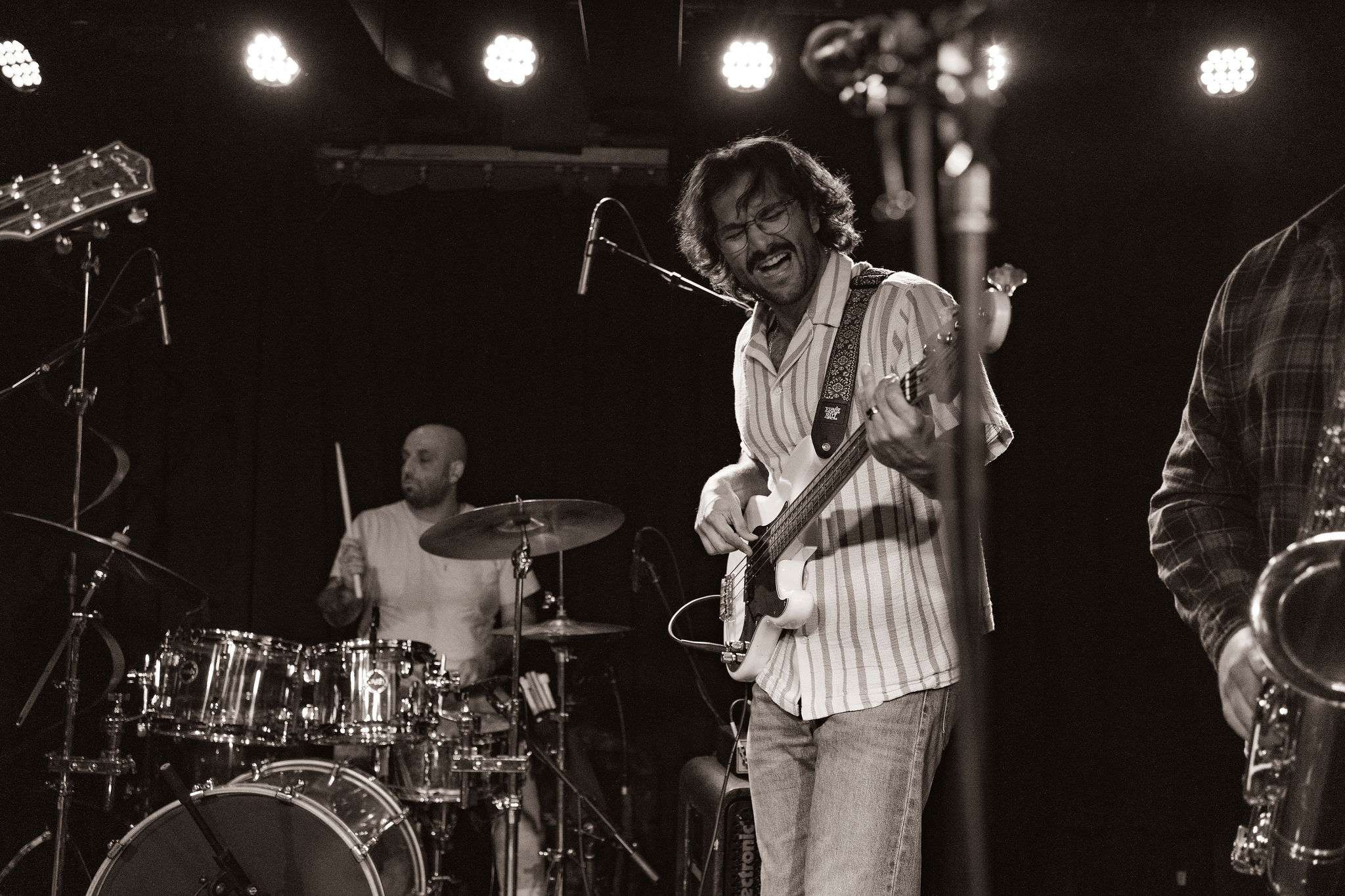 a black and white photo of a band playing music