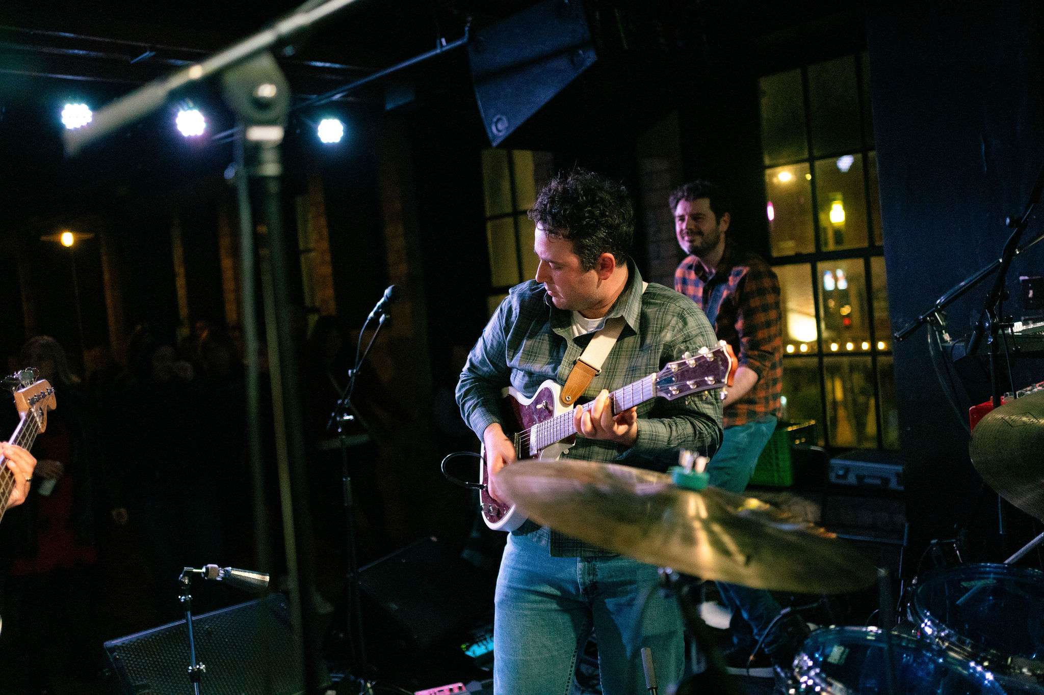 a group of people playing music in front of a crowd